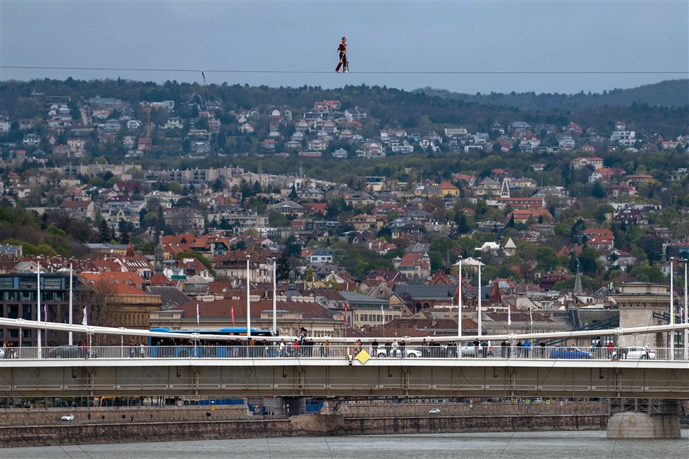 Acrobat Laszlo Simet walks on a wire rope to mark the World Circus Day in Budapest